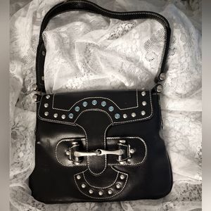 Western Style handbag in black leather, rhinestones, and a horsebit closure.